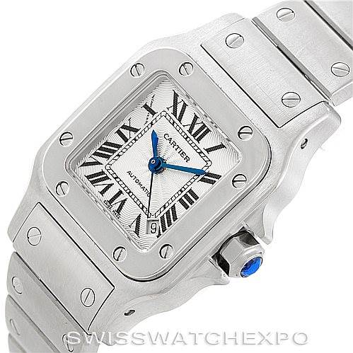 The image shows a close-up of the Santos model by Cartier, highlighting the face, bezel, and part of the bracelet.