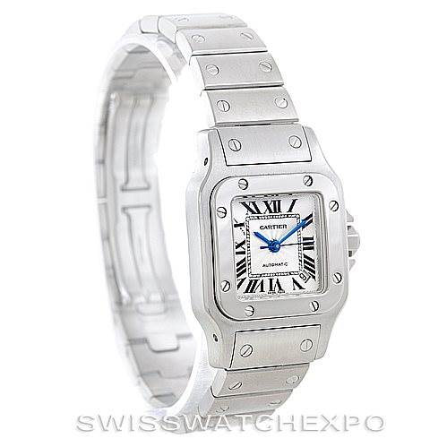 The image shows a Santos model watch by Cartier from an angled perspective, featuring the watch face, bezel, and bracelet.