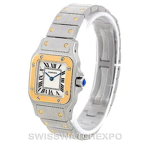 The Cartier Santos W20012C4 Women
s Stainless Steel Silver Dial W20012C4 Women
s Stainless Steel Silver Dial watch is shown from an angled front perspective, highlighting its square face, bracelet, and bezel accents.