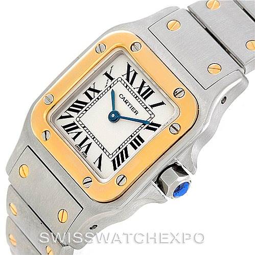 The image shows a close-up angle of a Cartier Santos W20012C4 Women
s Stainless Steel Silver Dial W20012C4 Women
s Stainless Steel Silver Dial watch, highlighting the dial, bezel, and bracelet.