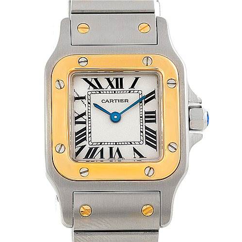 The image shows a front view of the dial and part of the bracelet of a Santos model watch by Cartier.
