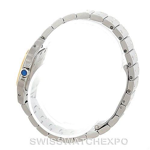 This image shows the side view of a Cartier Santos W20012C4 Women's Stainless Steel Silver Dial W20012C4 Women's Stainless Steel Silver Dial watch, highlighting the bezel, crown with a blue gem, and stainless steel bracelet.