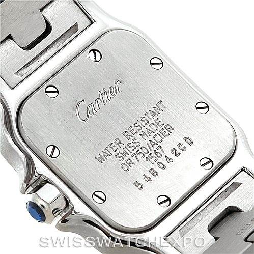 This image shows the back case of a Cartier Santos W20012C4 Women's Stainless Steel Silver Dial W20012C4 Women's Stainless Steel Silver Dial watch, displaying the brand, model details, and serial number.