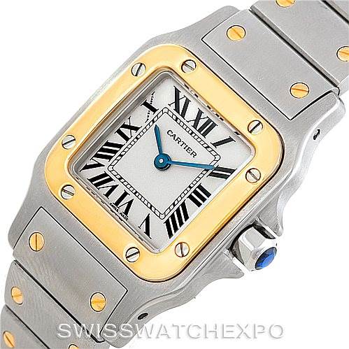 This image shows a Cartier Santos W20012C4 Women's Stainless Steel Silver Dial W20012C4 Women's Stainless Steel Silver Dial watch at a slight angle, focusing on the watch face, bezel, and part of the bracelet.