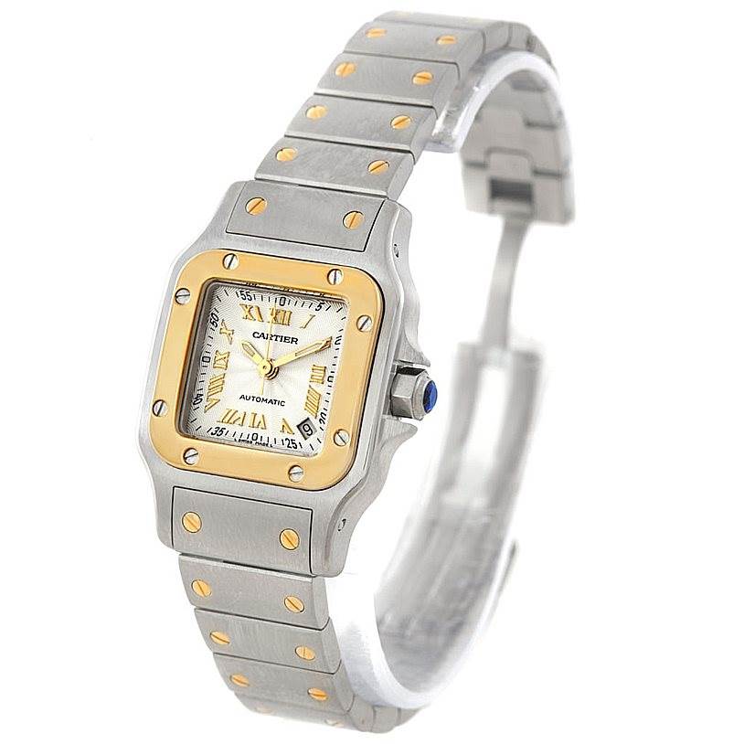 The angle shows the Cartier Santos W20057C4 Women
s Stainless Steel Silver Dial W20057C4 Women
s Stainless Steel Silver Dial watch face, bracelet, and clasp in a three-quarter view.