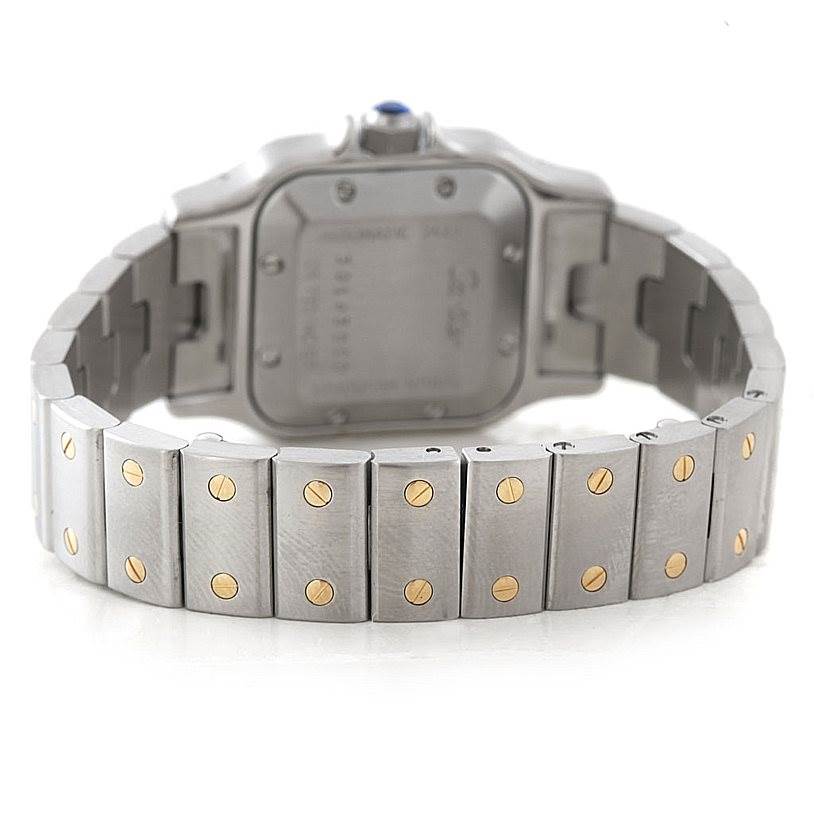 This image shows the back view of a Santos model by Cartier, highlighting the steel bracelet with gold screws.