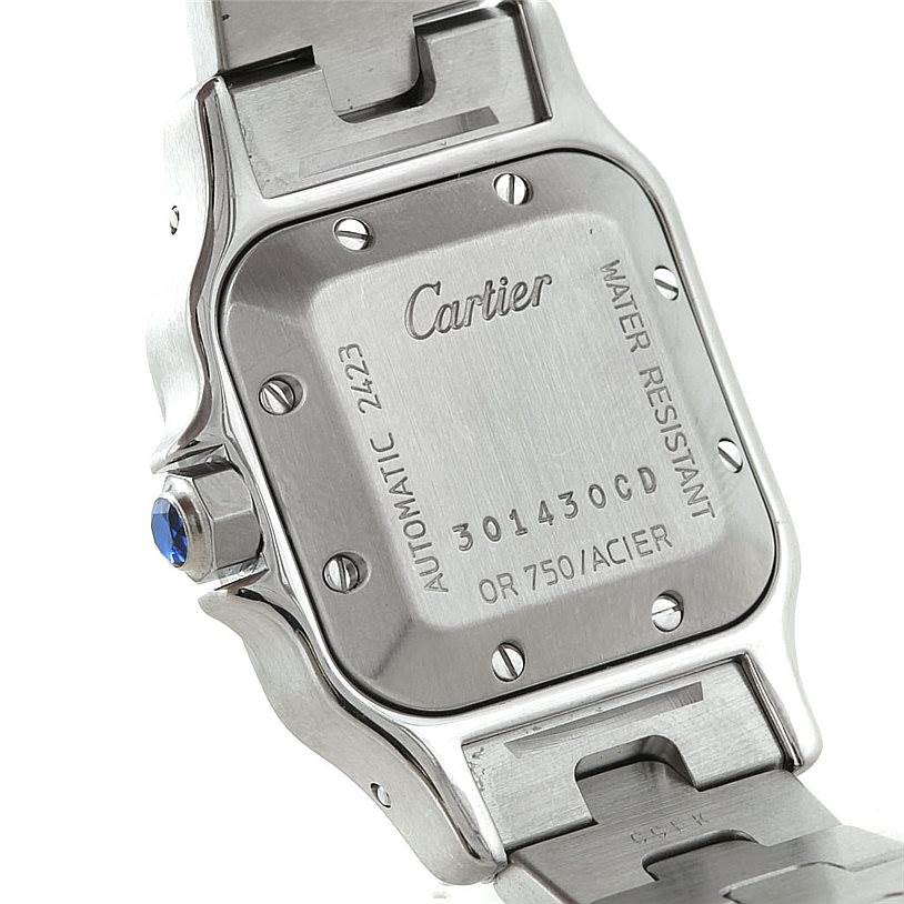 The image shows the back case of a Cartier Santos W20057C4 Women
s Stainless Steel Silver Dial W20057C4 Women
s Stainless Steel Silver Dial watch, displaying the brand, model information, and water resistance details.