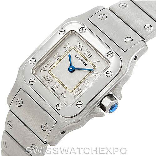 The image shows a top-down view of a Cartier Santos Women
s Stainless Steel Silver Dial Women
s Stainless Steel Silver Dial watch, highlighting its face, bezel, and part of the bracelet.