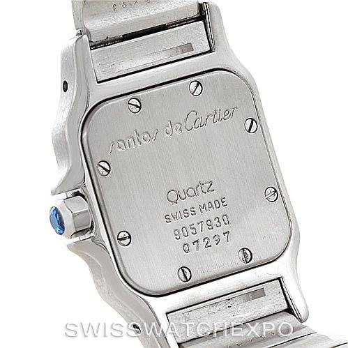 The image shows the back case of the Cartier Santos Women
s Stainless Steel Silver Dial Women
s Stainless Steel Silver Dial model watch, including the engraving and part of the bracelet.