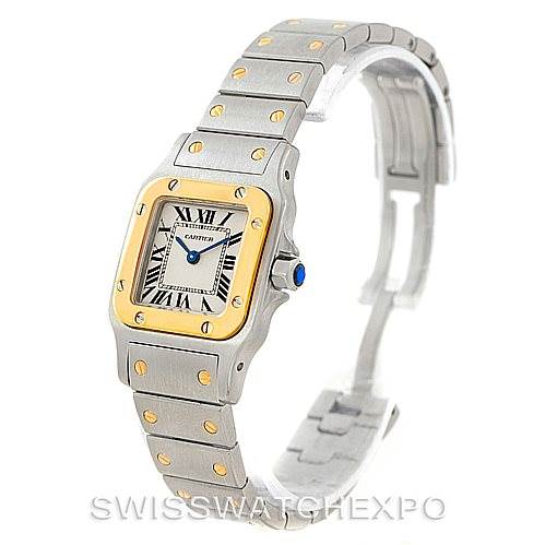 The Cartier Santos W20012C4 Women's Stainless Steel Silver Dial W20012C4 Women's Stainless Steel Silver Dial watch is shown at a three-quarter angle, highlighting its face, bezel, and bracelet.