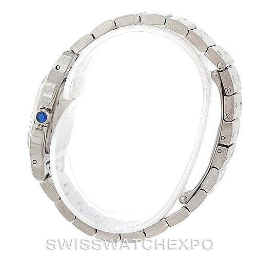 The image shows a side view of the Cartier Santos W20056D6 Women
s Stainless Steel Silver Dial W20056D6 Women
s Stainless Steel Silver Dial watch, highlighting the bracelet and crown with a blue cabochon.