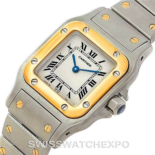 The image shows a close-up of the Cartier Santos W20012C4 Women
s Stainless Steel Silver Dial W20012C4 Women
s Stainless Steel Silver Dial watch, displaying its face, bezel, and part of the strap.