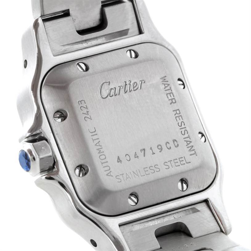 This image shows the back case and part of the bracelet of a Cartier Santos W20044D6 Women
s Stainless Steel Silver Dial W20044D6 Women
s Stainless Steel Silver Dial watch, highlighting its water resistance and stainless steel composition.