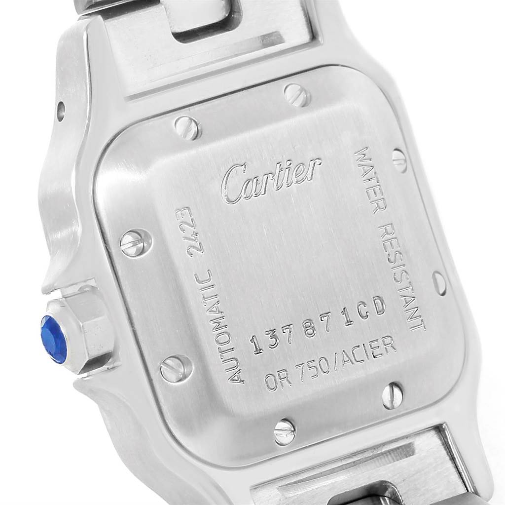 The image shows the back case of a Cartier Santos W20057C4 Women
s Stainless Steel Silver Dial W20057C4 Women
s Stainless Steel Silver Dial watch, displaying the model number and brand details.