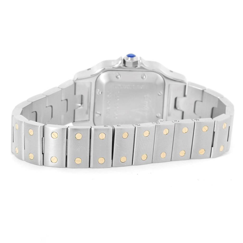 The image shows the back and bracelet of a Cartier Santos W20057C4 Women
s Stainless Steel Silver Dial W20057C4 Women
s Stainless Steel Silver Dial watch, highlighting its metal links and clasp.