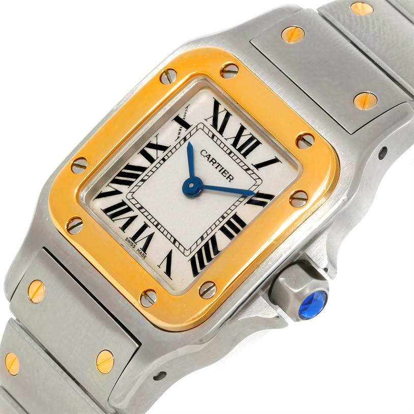 The image shows a close-up of the Cartier Santos W20012C4 Women
s Stainless Steel Silver Dial W20012C4 Women
s Stainless Steel Silver Dial watch face, including the dial, bezel, and part of the bracelet.