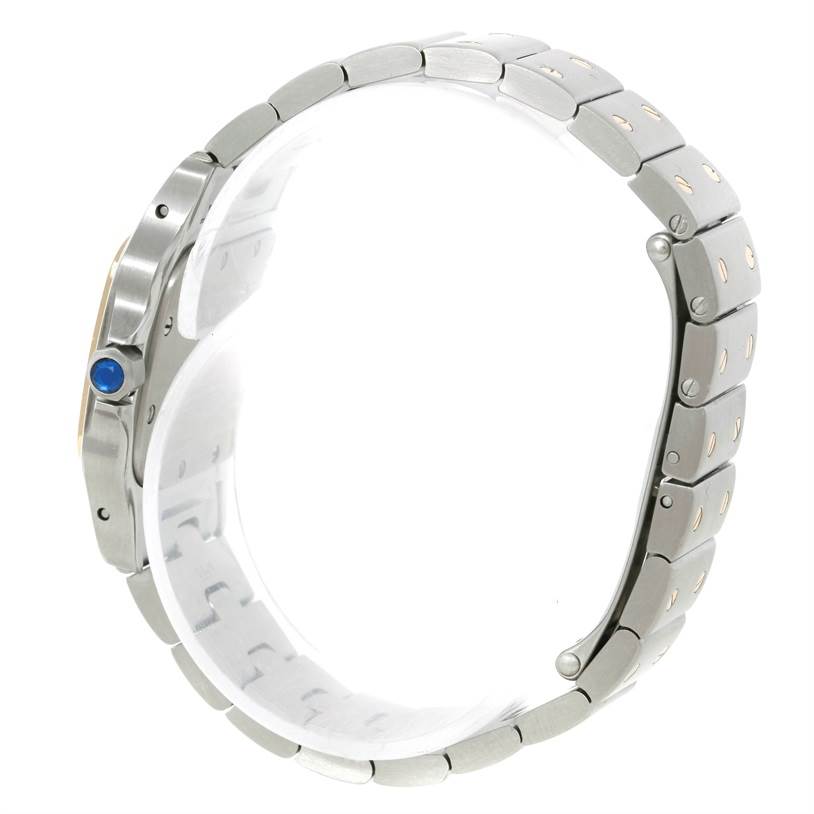 The image shows a side view of the Cartier Santos W20012C4 Women
s Stainless Steel Silver Dial W20012C4 Women
s Stainless Steel Silver Dial watch, highlighting the bracelet and the blue cabochon crown.