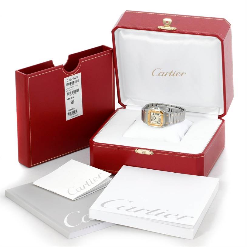 The image shows a Cartier Santos W20012C4 Women's Stainless Steel Silver Dial W20012C4 Women's Stainless Steel Silver Dial watch in its open red box, along with additional booklets and packaging.