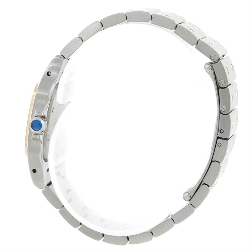 This side view shows the bezel, crown with a blue gemstone, and bracelet of the Cartier Santos W20012C4 Women's Stainless Steel Silver Dial W20012C4 Women's Stainless Steel Silver Dial watch.