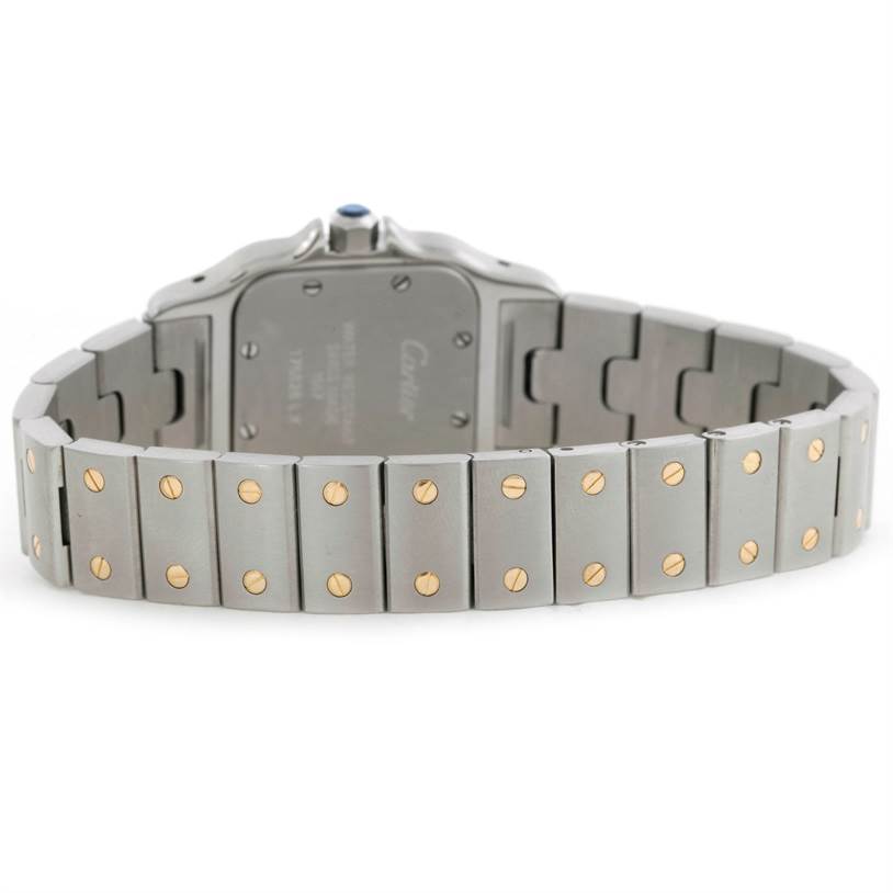 The image shows the back view of a Cartier Santos W20012C4 Women's Stainless Steel Silver Dial W20012C4 Women's Stainless Steel Silver Dial watch, focusing on its metal bracelet with gold screws.