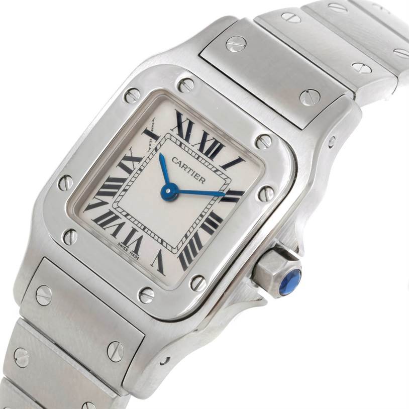 This image shows a close-up of the dial, crown, and bracelet of a Cartier Santos W20056D6 Women
s Stainless Steel Silver Dial W20056D6 Women
s Stainless Steel Silver Dial watch from an angled perspective.