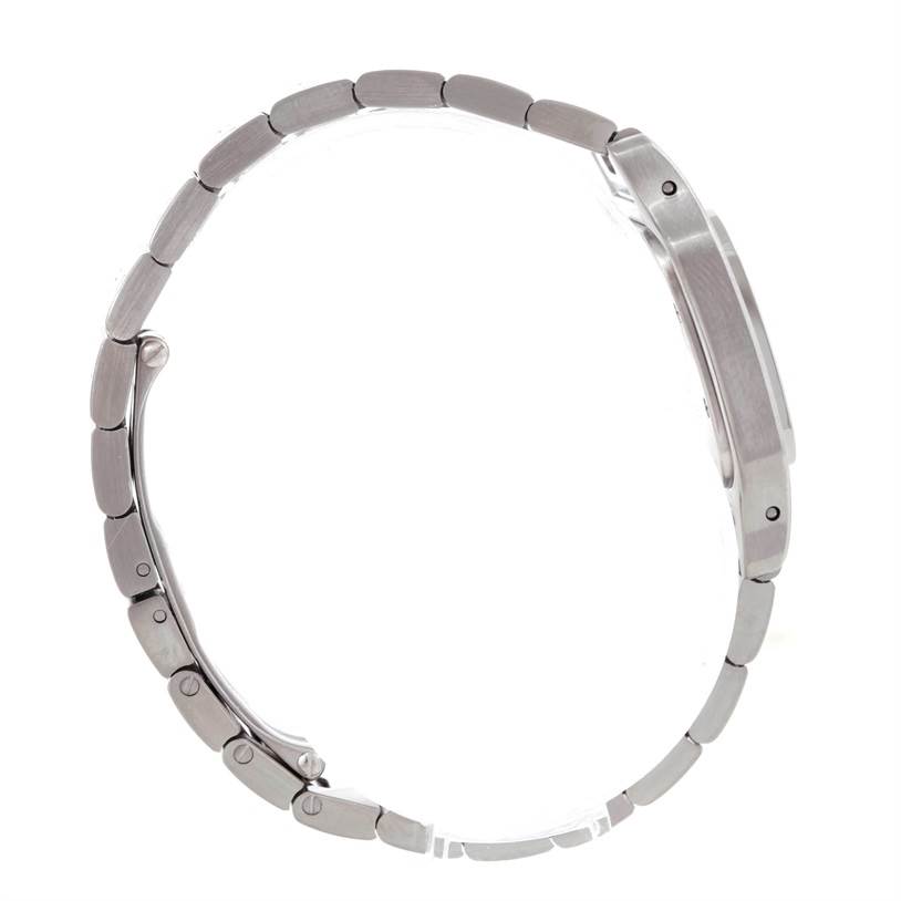 The image shows a side view of the Santos model by Cartier, highlighting its stainless steel bracelet and case.