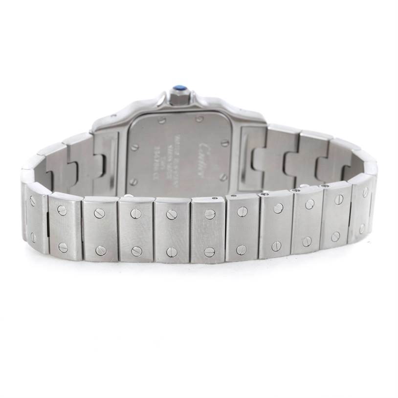This image shows the back view of a Santos model watch by Cartier, highlighting the case back and metal bracelet.