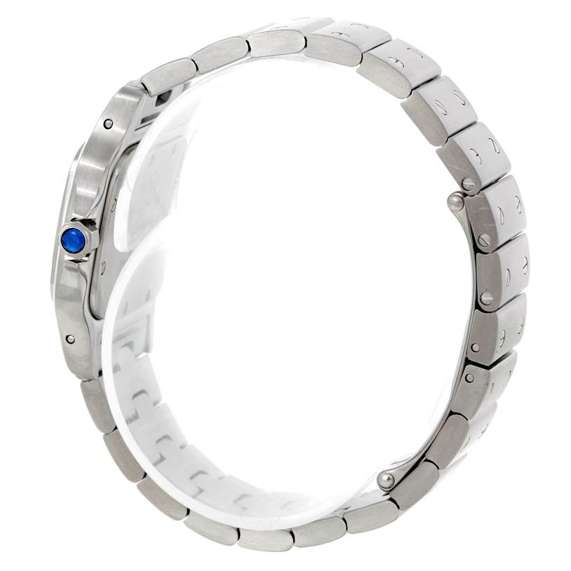 The image shows a side view of the Cartier Santos W20056D6 Women
s Stainless Steel Silver Dial W20056D6 Women
s Stainless Steel Silver Dial watch, focusing on the metal bracelet and crown with a blue cabochon.