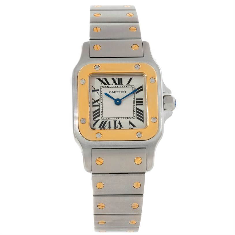 The image shows a front view of the Cartier Santos W20012C4 Women
s Stainless Steel Silver Dial W20012C4 Women
s Stainless Steel Silver Dial watch, highlighting its square face, two-tone bezel, and detailed bracelet.
