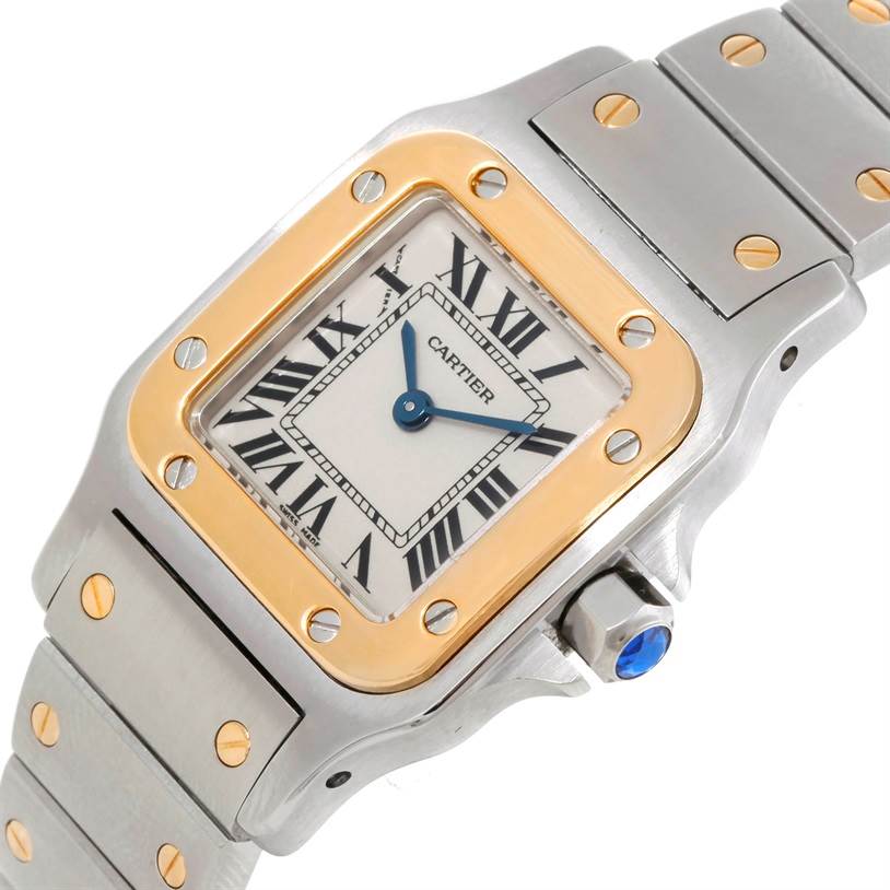 The image shows a close-up view of the Cartier Santos W20012C4 Women
s Stainless Steel Silver Dial W20012C4 Women
s Stainless Steel Silver Dial watch, highlighting its bezel, dial, crown, and part of the bracelet.