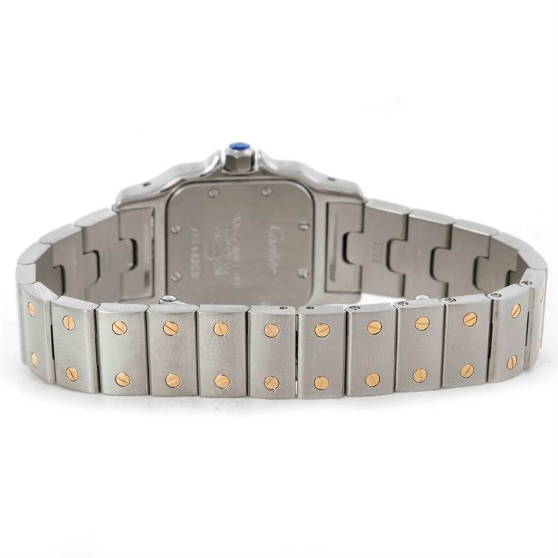 This image shows the back view of a Cartier Santos W20012C4 Women
s Stainless Steel Silver Dial W20012C4 Women
s Stainless Steel Silver Dial watch with its metal bracelet and case back visible.