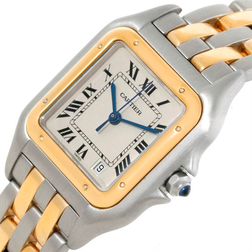 This image shows the face, crown, and part of the band of a Cartier Panthère watch at a slight angle.