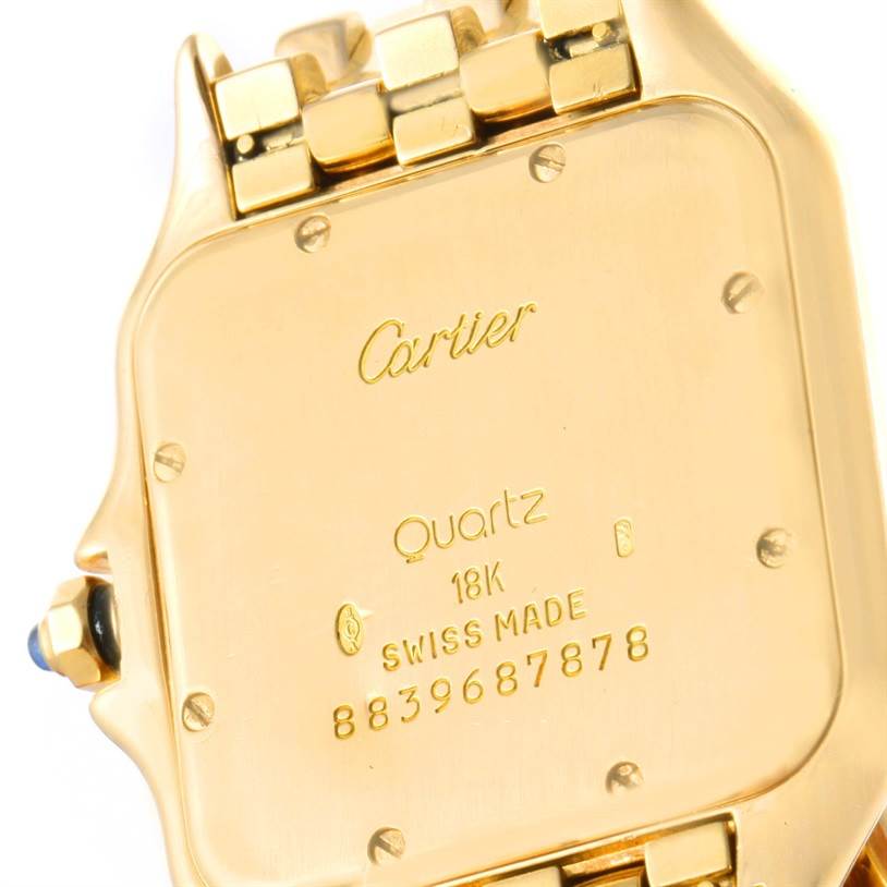 The image shows the back case of a Cartier Panthere W25014B9 Yellow Gold Silver Dial W25014B9 Yellow Gold Silver Dial watch, highlighting its gold material and engraved details.