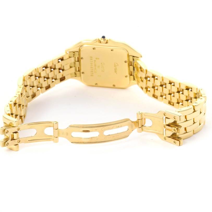 The image shows the back case and gold bracelet clasp of a Cartier Panthere W25014B9 Yellow Gold Silver Dial W25014B9 Yellow Gold Silver Dial watch from a rear angle.