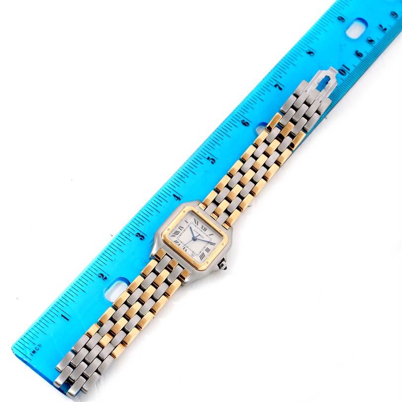 The image shows a Panthere model by Cartier laid flat next to a blue ruler for size reference.