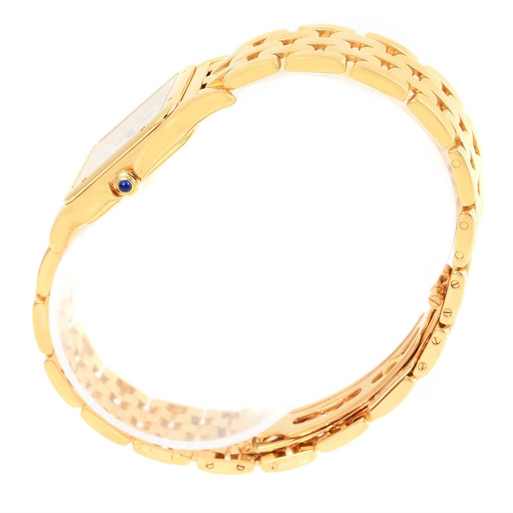 The image shows a side profile view of the Cartier Panthere W25014B9 Yellow Gold Silver Dial W25014B9 Yellow Gold Silver Dial watch, highlighting its gold case, blue crown, and bracelet.