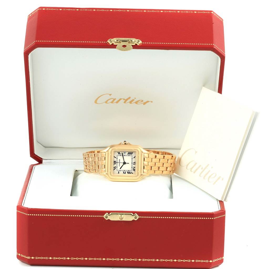 The Cartier Panthere W25014B9 Yellow Gold Silver Dial W25014B9 Yellow Gold Silver Dial watch is displayed in a red box, showing the face and bracelet, with a booklet on the side.