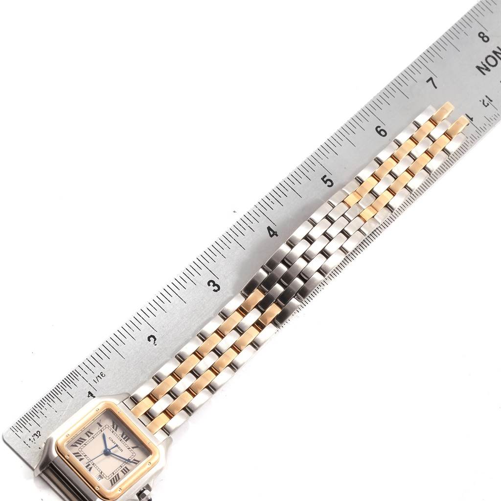 The image shows a Cartier Panthere W25028B8 Steel and Gold (two tone) Silver Dial W25028B8 Steel and Gold (two tone) Silver Dial watch laid flat alongside a ruler, highlighting the bracelet and dial at an aerial angle.