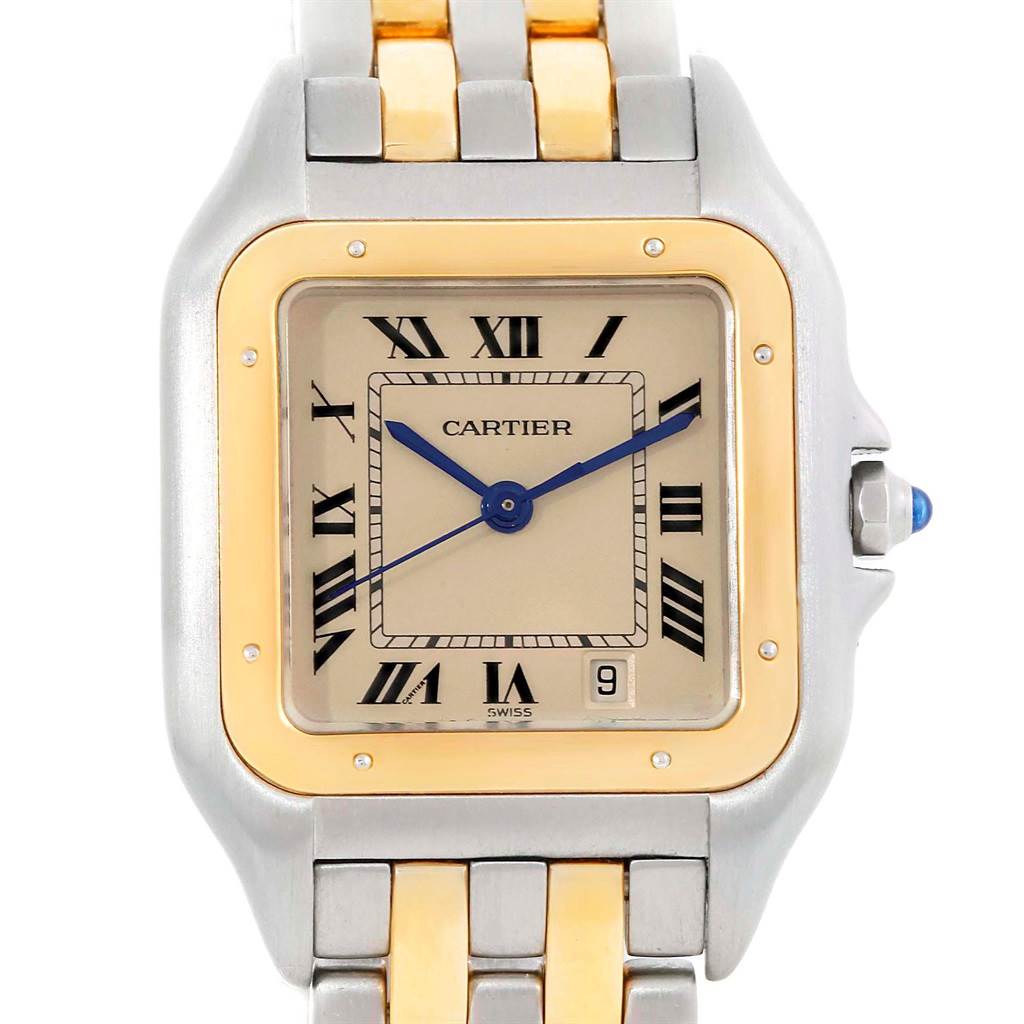 The image shows a close-up view of the Panthère model by Cartier, featuring its two-tone bezel, face, and part of the bracelet.