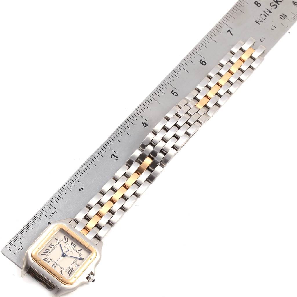 The image shows a Cartier Panthere 187957 Steel and Gold (two tone) Silver Dial 187957 Steel and Gold (two tone) Silver Dial model watch placed next to a ruler, angled to display the bracelet and watch face.
