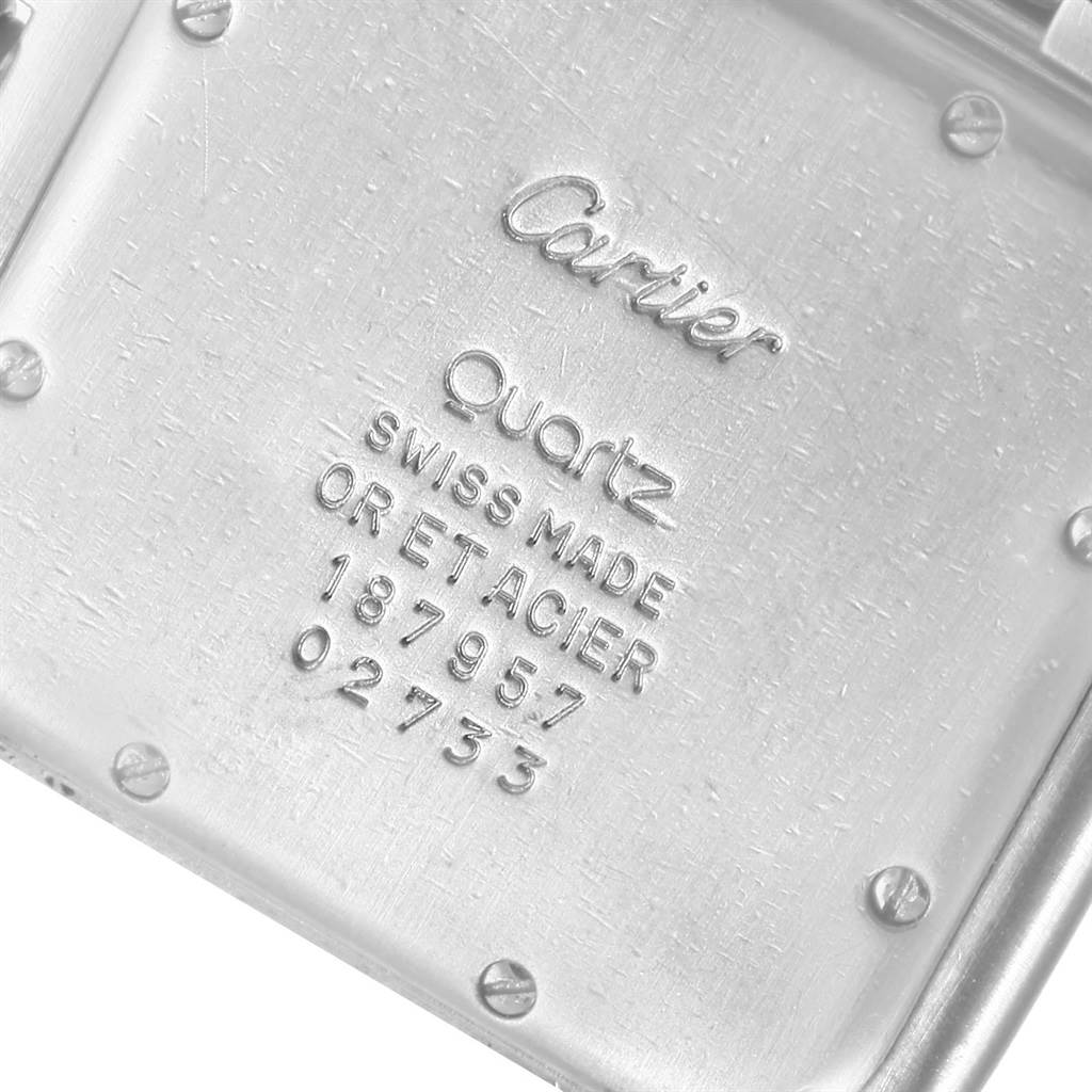 This close-up image shows the back case of a Panthere model watch by Cartier, displaying text and screw details.