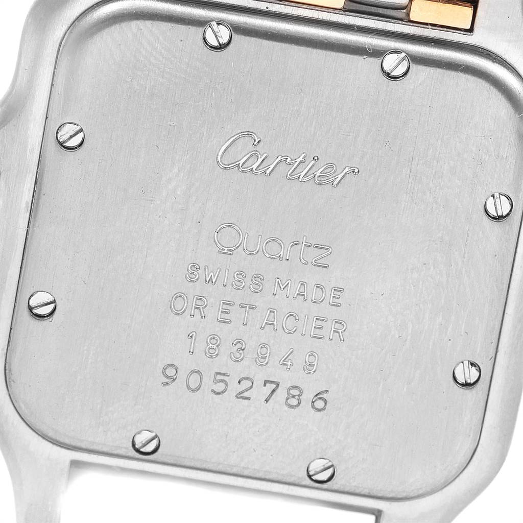 This image shows the case back of a Cartier Panthere W25028B6 Steel and Gold (two tone) Silver Dial W25028B6 Steel and Gold (two tone) Silver Dial watch, featuring engraving details and screws.