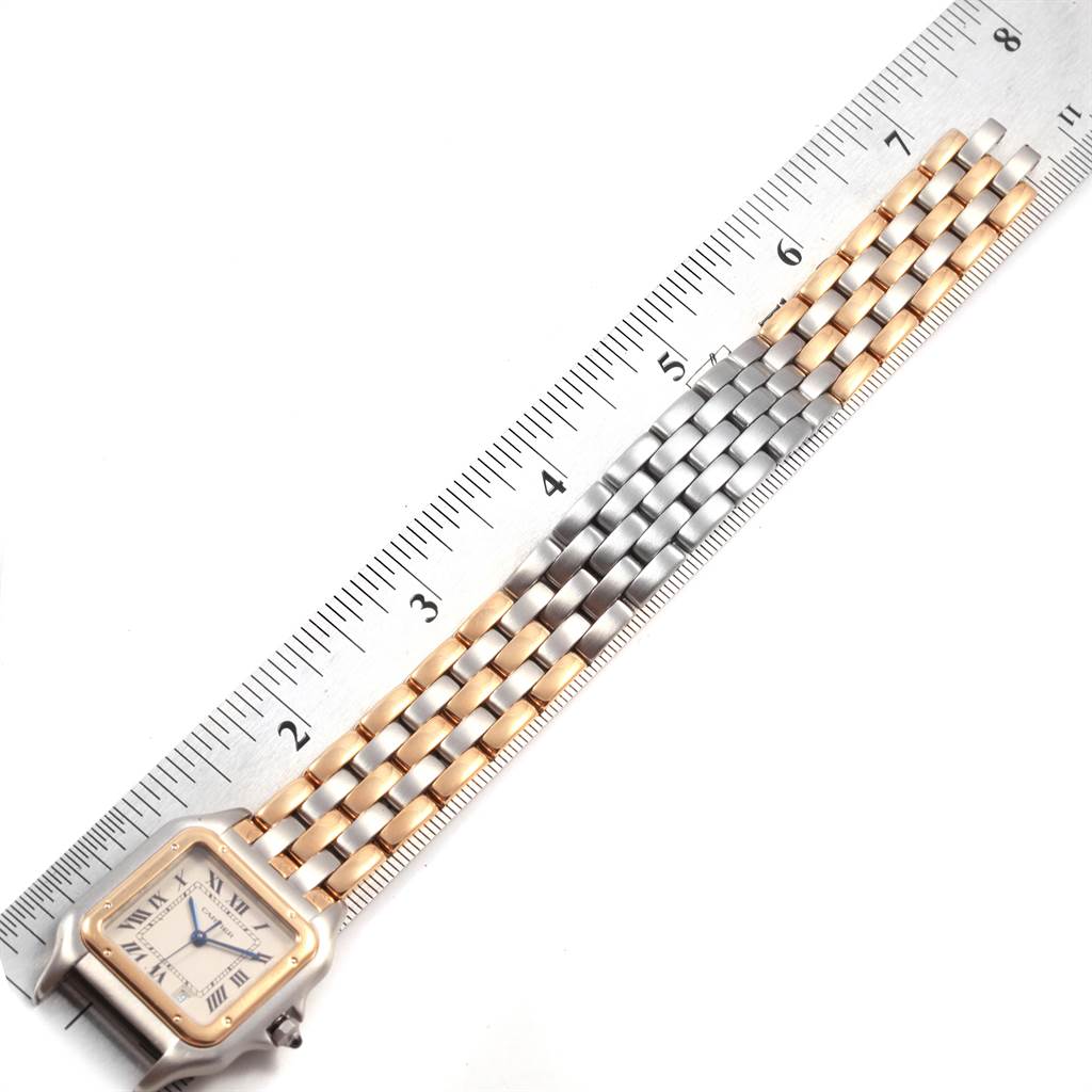 The image shows the Cartier Panthere W25028B6 Steel and Gold (two tone) Silver Dial W25028B6 Steel and Gold (two tone) Silver Dial watch flat with an emphasis on the band and part of the face, measured against a ruler.