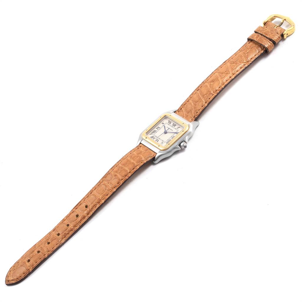 The Panthère de Cartier watch is shown at a slight angle, displaying its face, case, and brown leather strap.