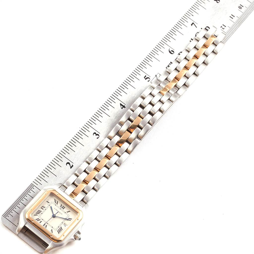 The image shows the face and metal strap of a Cartier Panthere 187957 Steel and Gold (two tone) Silver Dial 187957 Steel and Gold (two tone) Silver Dial watch placed next to a ruler for measurement.