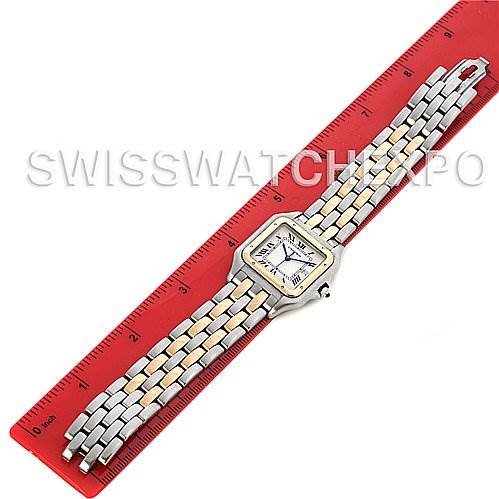 This Cartier Panthere W25028B6 Men's Steel and Gold (two tone) White Dial W25028B6 Men's Steel and Gold (two tone) White Dial watch is displayed flat on a red ruler, showing its face and entire two-tone bracelet.