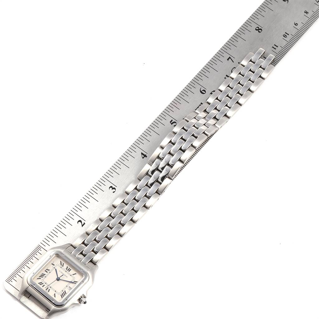 The image shows the Panthere model by Cartier, positioned alongside a ruler to measure the length of its bracelet.
