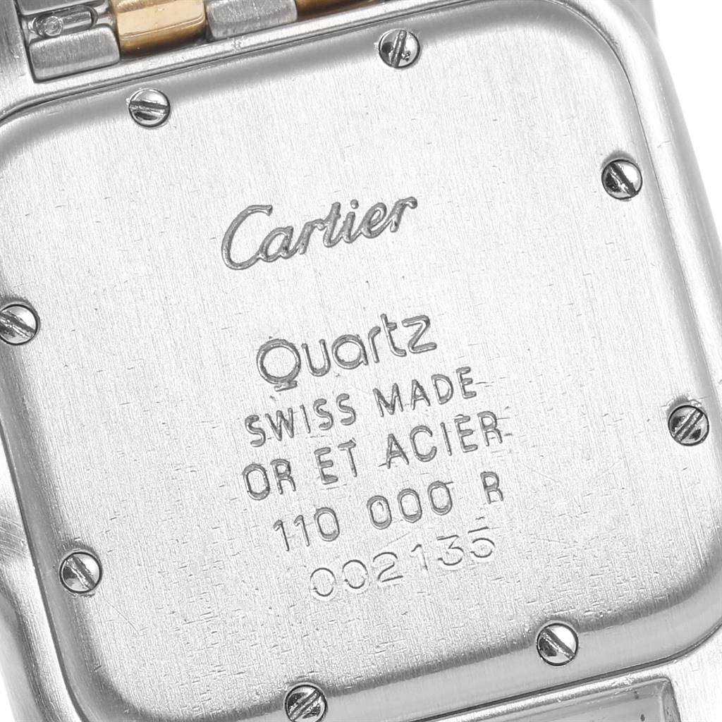 The image shows the back case of a Cartier Panthere W25028B8 Steel and Gold (two tone) White Dial W25028B8 Steel and Gold (two tone) White Dial model watch, highlighting its inscriptions and screws.
