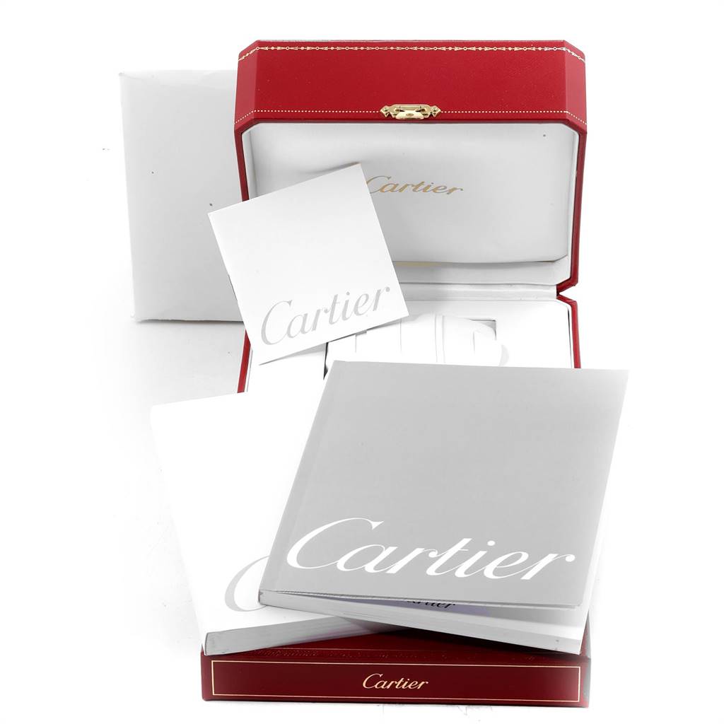 The image shows the packaging and booklets for a Cartier Panthere W25014B9 Men's Yellow Gold Silver Dial W25014B9 Men's Yellow Gold Silver Dial model watch from a top angle.
