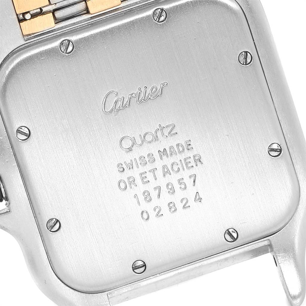 The image shows the backside of a Panthere model by Cartier, highlighting the serial number and "Swiss Made" engraving.